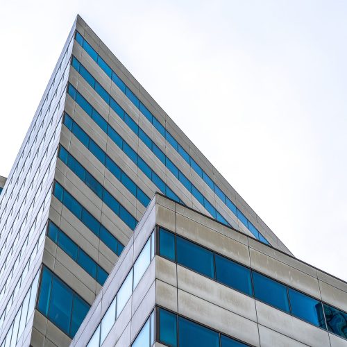 A modern skyscraper with many windows during daytime